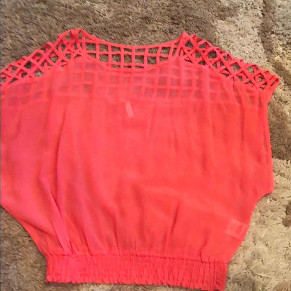 Salmon colored sheer blouse